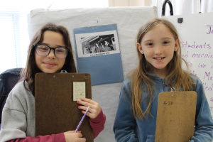  students observing stations in a "gallery" of primary sources